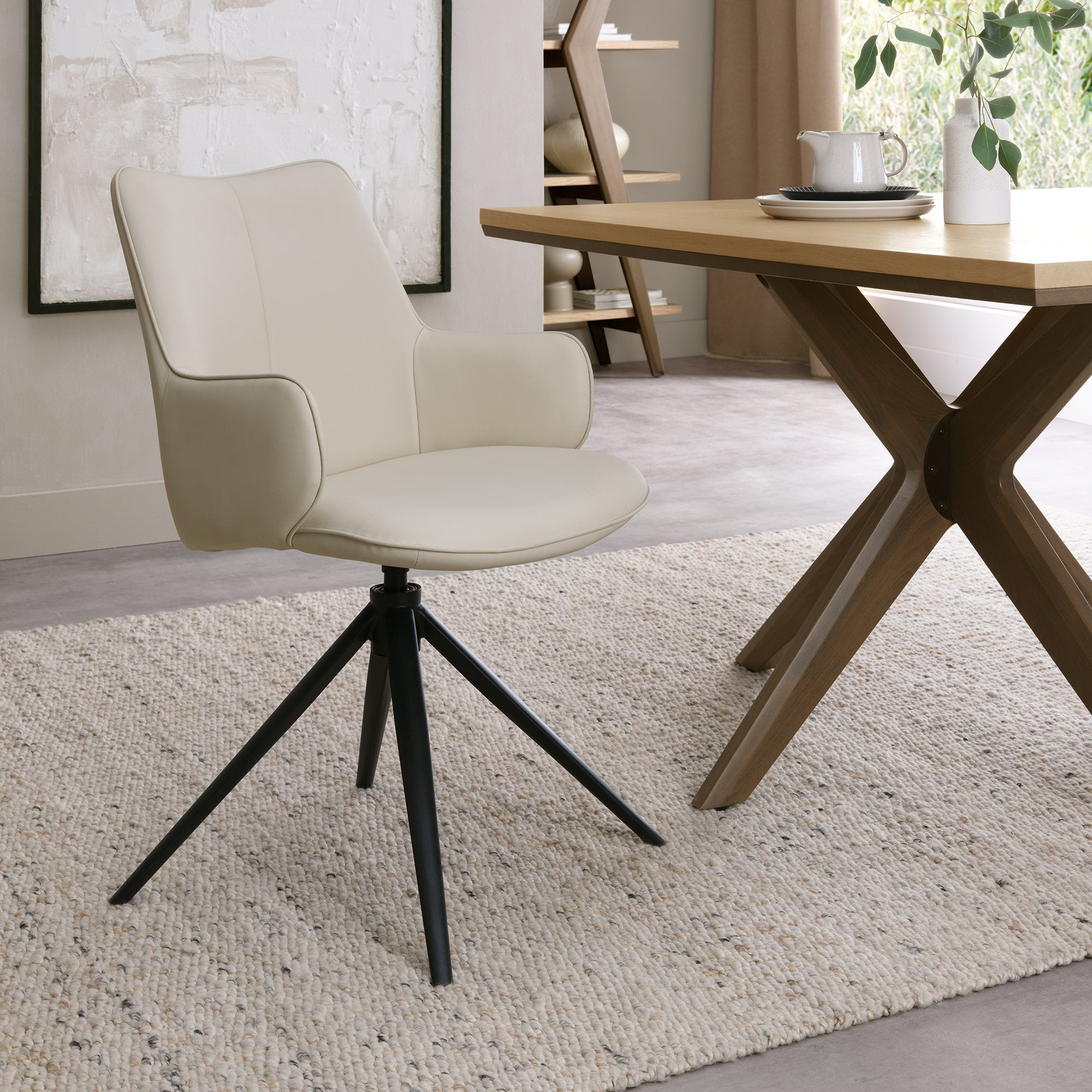 Rowan - 360° Self Returning Swivel Chair in a Ivory Faux Leather with Black Legs (Single)