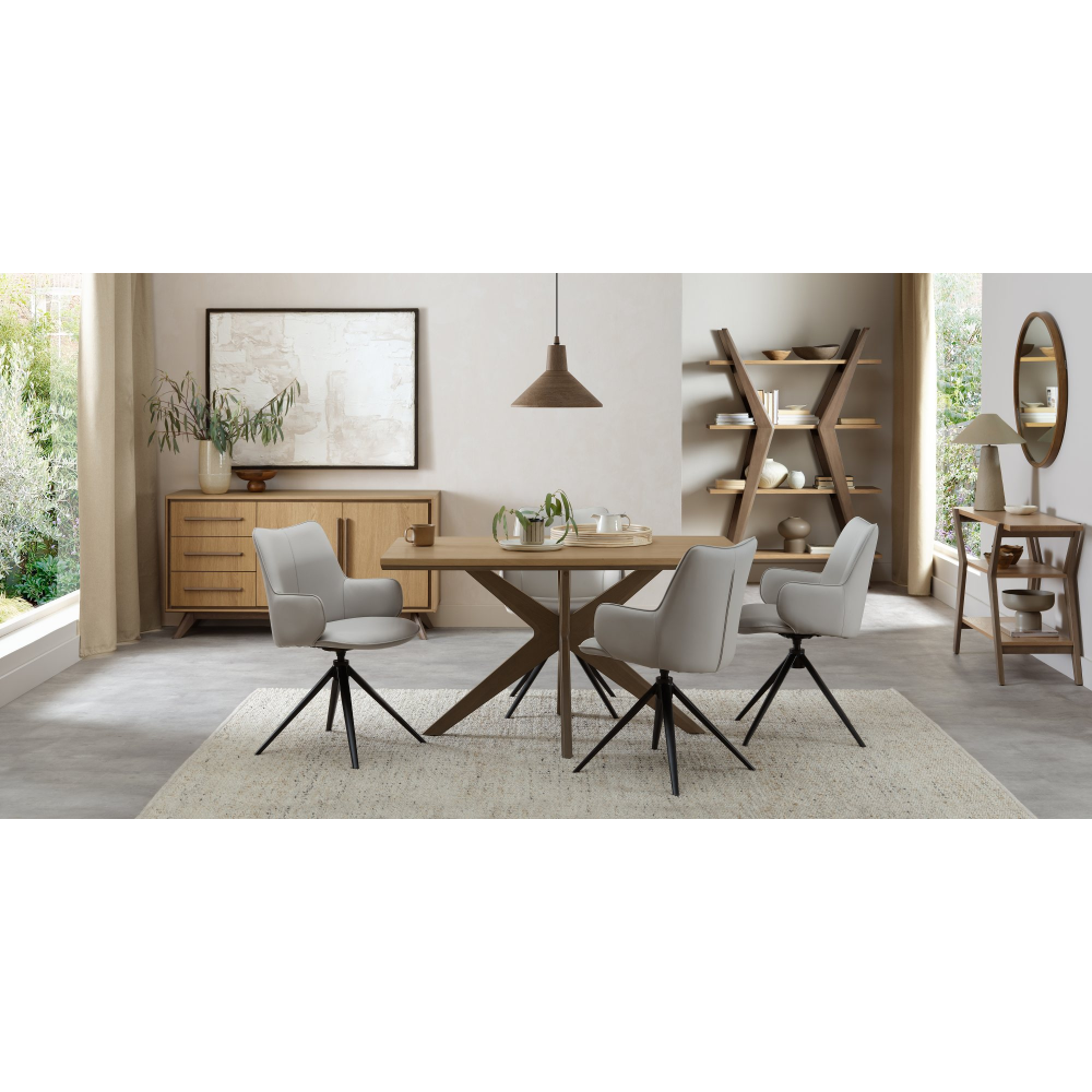 Rowan - 360° Self Returning Swivel Chair in a Light Grey Faux Leather with Black Legs (Single)